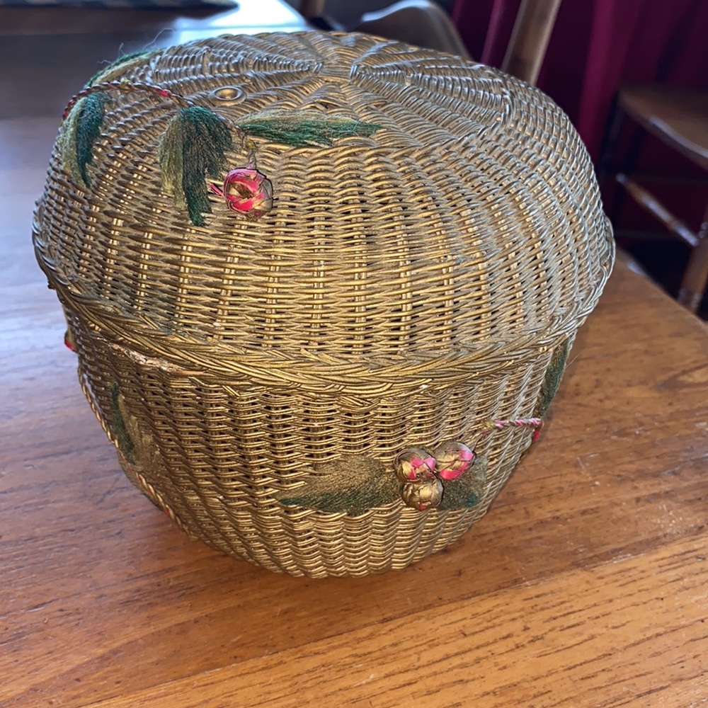 Vintage wicker woven lidded gold tone basket with “cherry blossom”embellishments